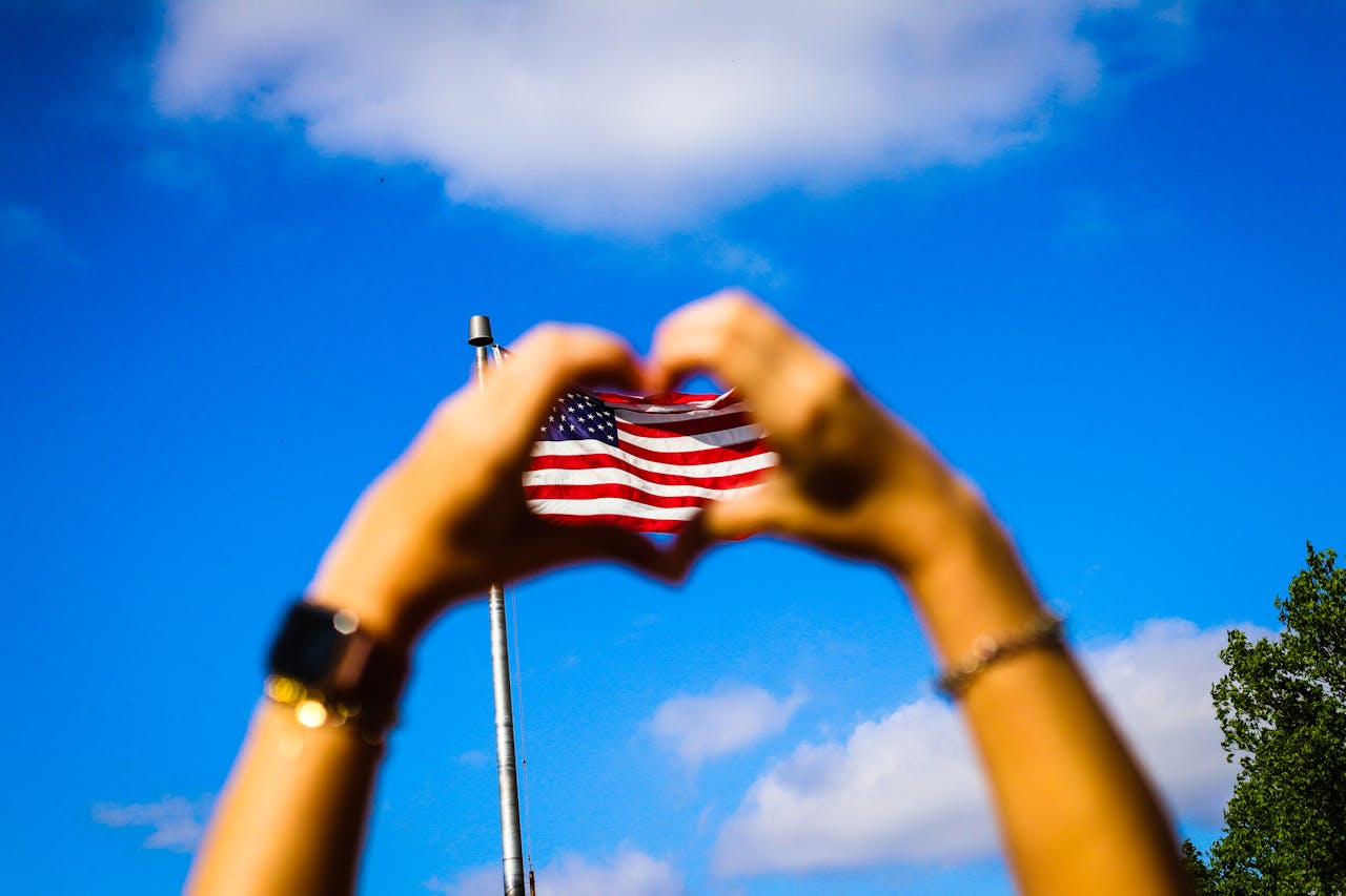 https://www.pexels.com/photo/human-hands-and-us-flag-2240293/  Photo by Edgar Colomba on Pexels 