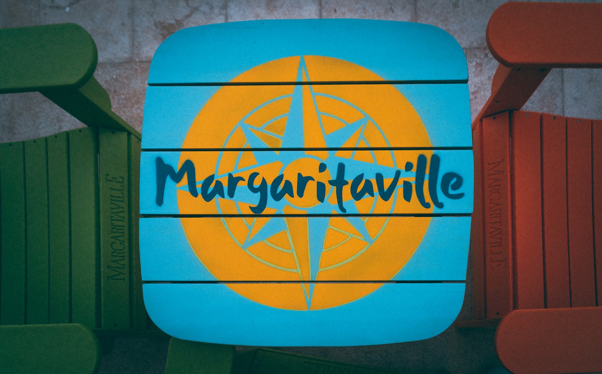 https://unsplash.com/photos/a-blue-and-yellow-sign-that-reads-margaritaville-WEm5BVa2lig  Photo by stevosdisposable on Unsplash 