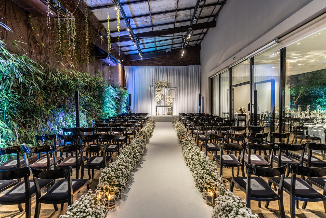 Photo by Matheus Bertelli: https://www.pexels.com/photo/a-wedding-venue-decorated-with-white-flowers-17315417/ 