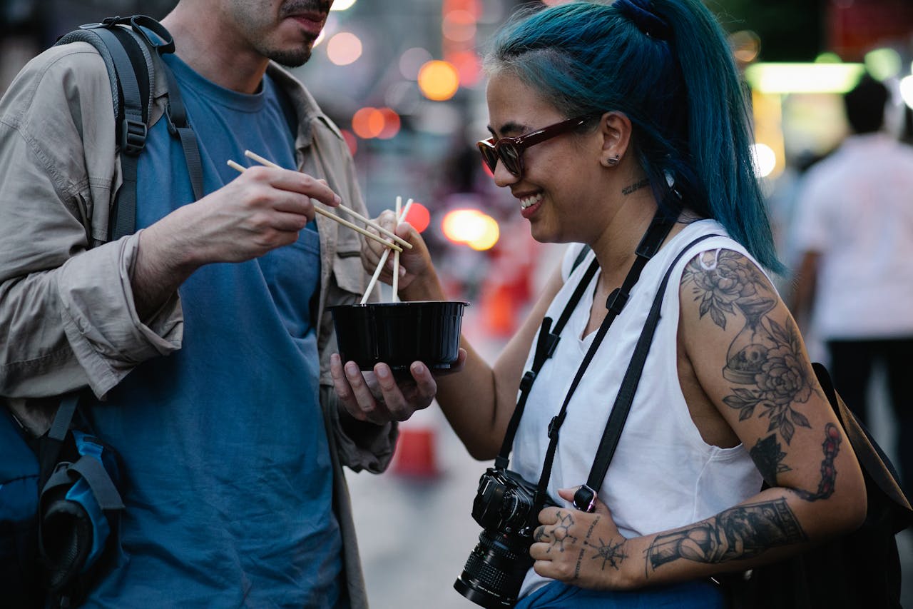 https://www.pexels.com/photo/man-and-woman-holding-chopsticks-7968961/  Photo by George Pak on Pexels