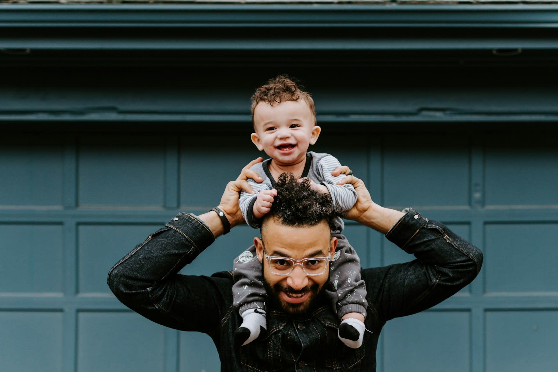 https://unsplash.com/photos/man-in-black-leather-jacket-carrying-boy-in-black-leather-jacket-hS_eGxLjozs Photo by Kelly Sikkema on Unsplash