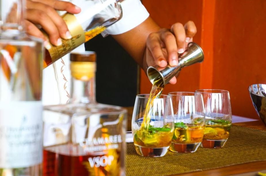 Photo by Magda Ehlers: https://www.pexels.com/photo/person-poring-cocktail-on-clear-drinking-glass-1189257/ 