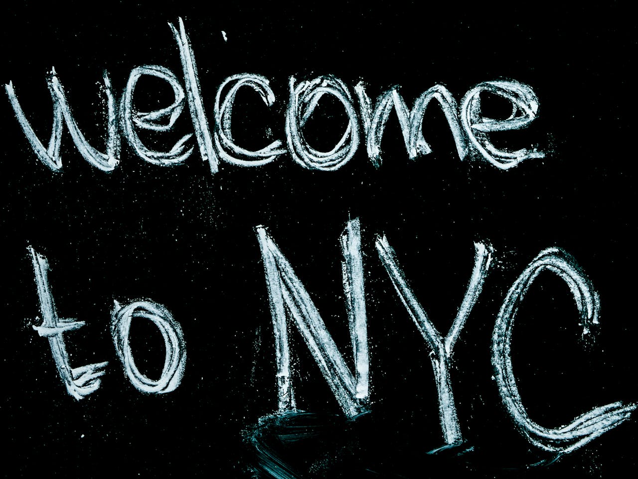 Photo by Mike: https://www.pexels.com/photo/black-background-with-welcome-to-nyc-text-overlay-1181810/