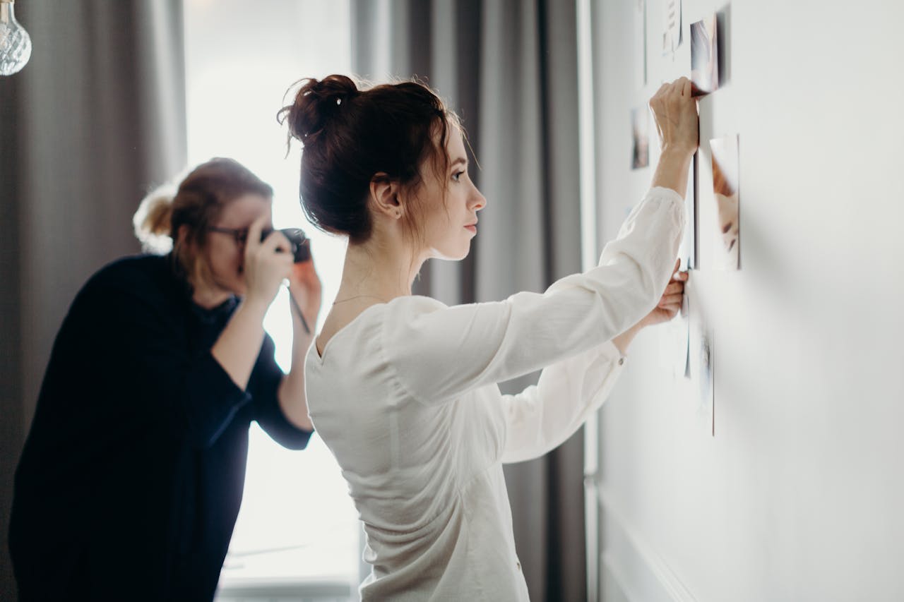 Photo by cottonbro studio: https://www.pexels.com/photo/woman-putting-photo-on-the-wall-3585030/ 