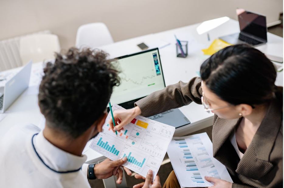 https://www.pexels.com/photo/colleagues-looking-at-graphs-7693745/ 