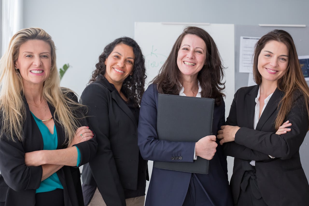 Photo by Kampus Production: https://www.pexels.com/photo/smiling-women-wearing-black-blazers-8171197/
