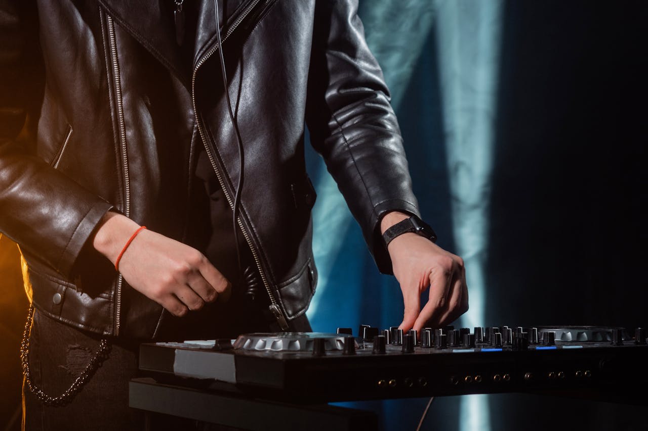 Photo by Alena Darmel: https://www.pexels.com/photo/person-in-black-leather-jacket-playing-black-and-white-electric-keyboard-7715473/