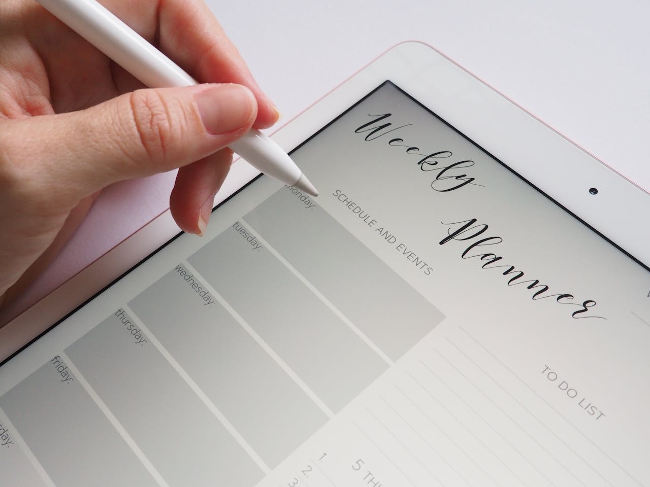 Photo by Jess Bailey Designs: https://www.pexels.com/photo/person-holding-white-stylus-768472/