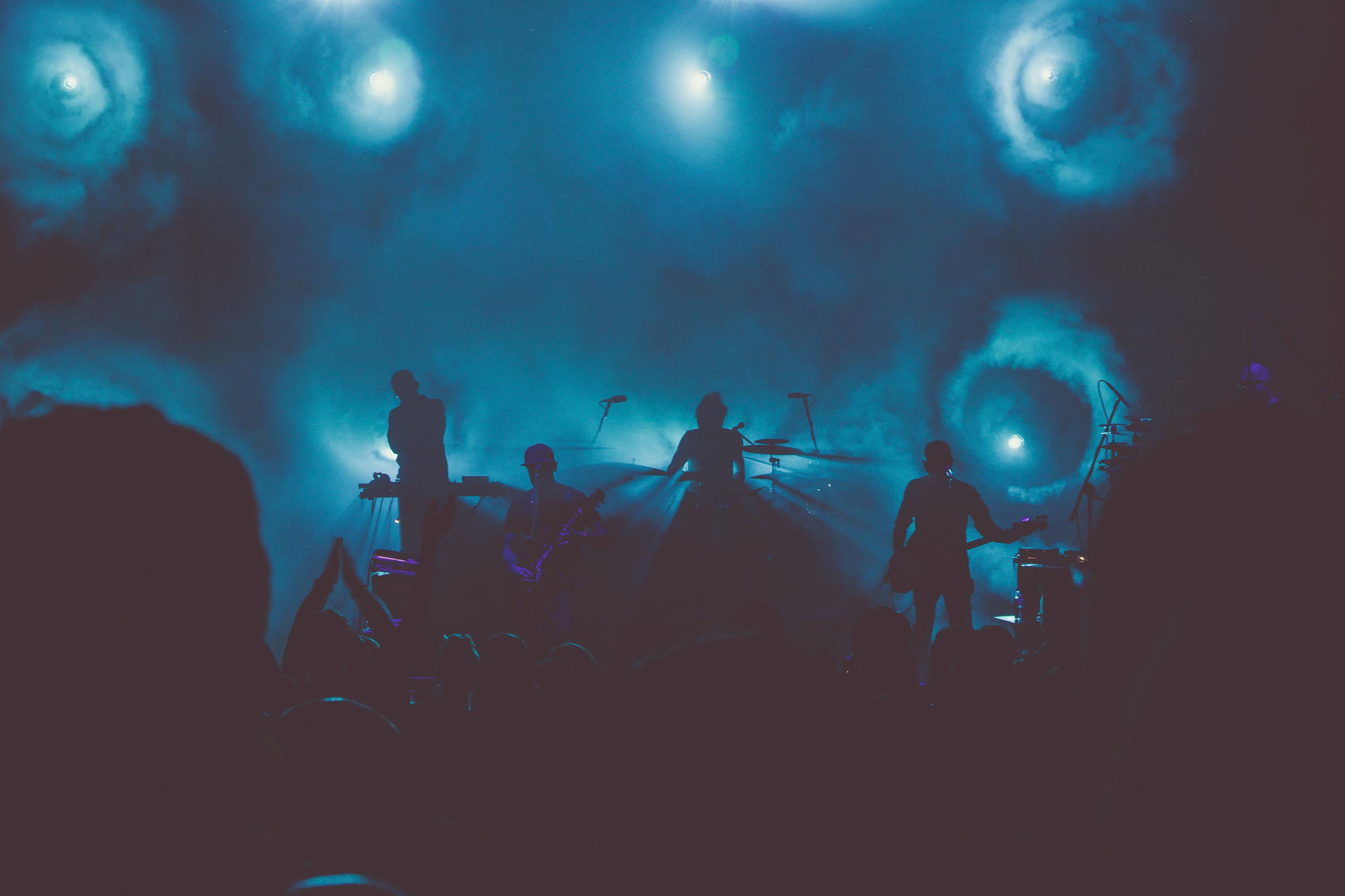 https://www.pexels.com/photo/music-band-performs-on-stage-during-nighttime-736355/