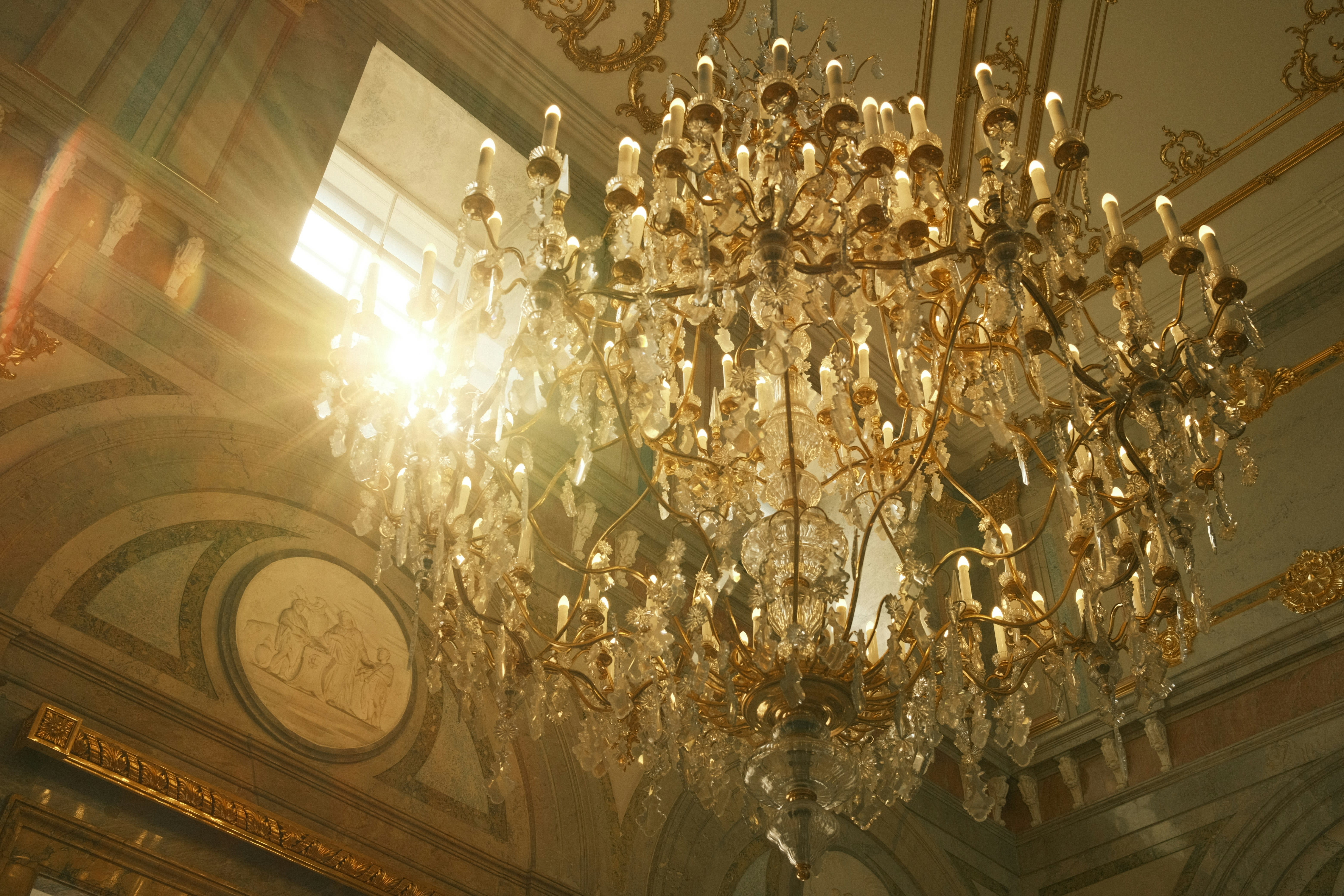 https://unsplash.com/photos/a-chandelier-hanging-from-the-ceiling-of-a-building-RMIQ_bpgYJs