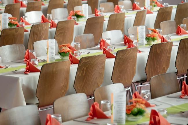 https://www.pexels.com/photo/long-tables-with-white-cloths-and-brown-chairs-formal-setting-50675/ 