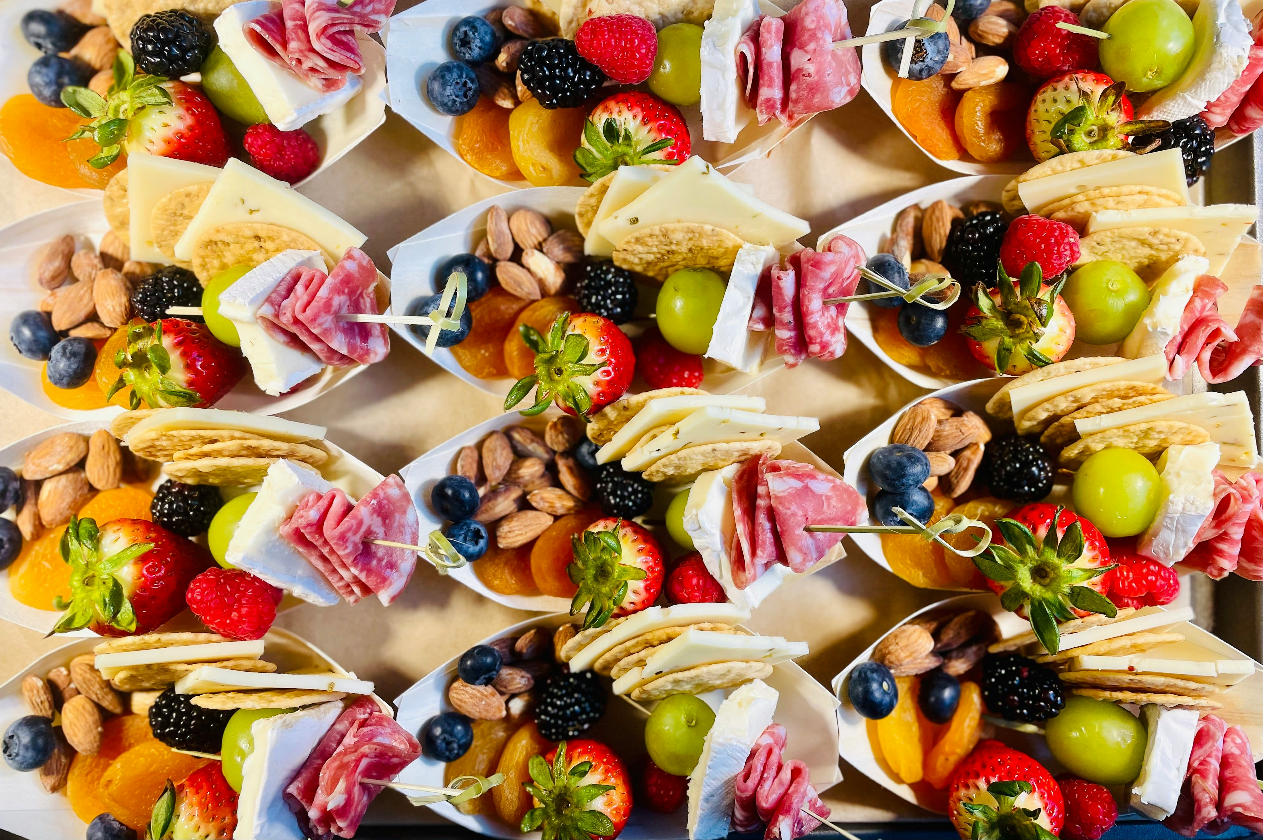 https://unsplash.com/photos/a-platter-of-fruit-nuts-and-crackers-AwmoMKgzxRE