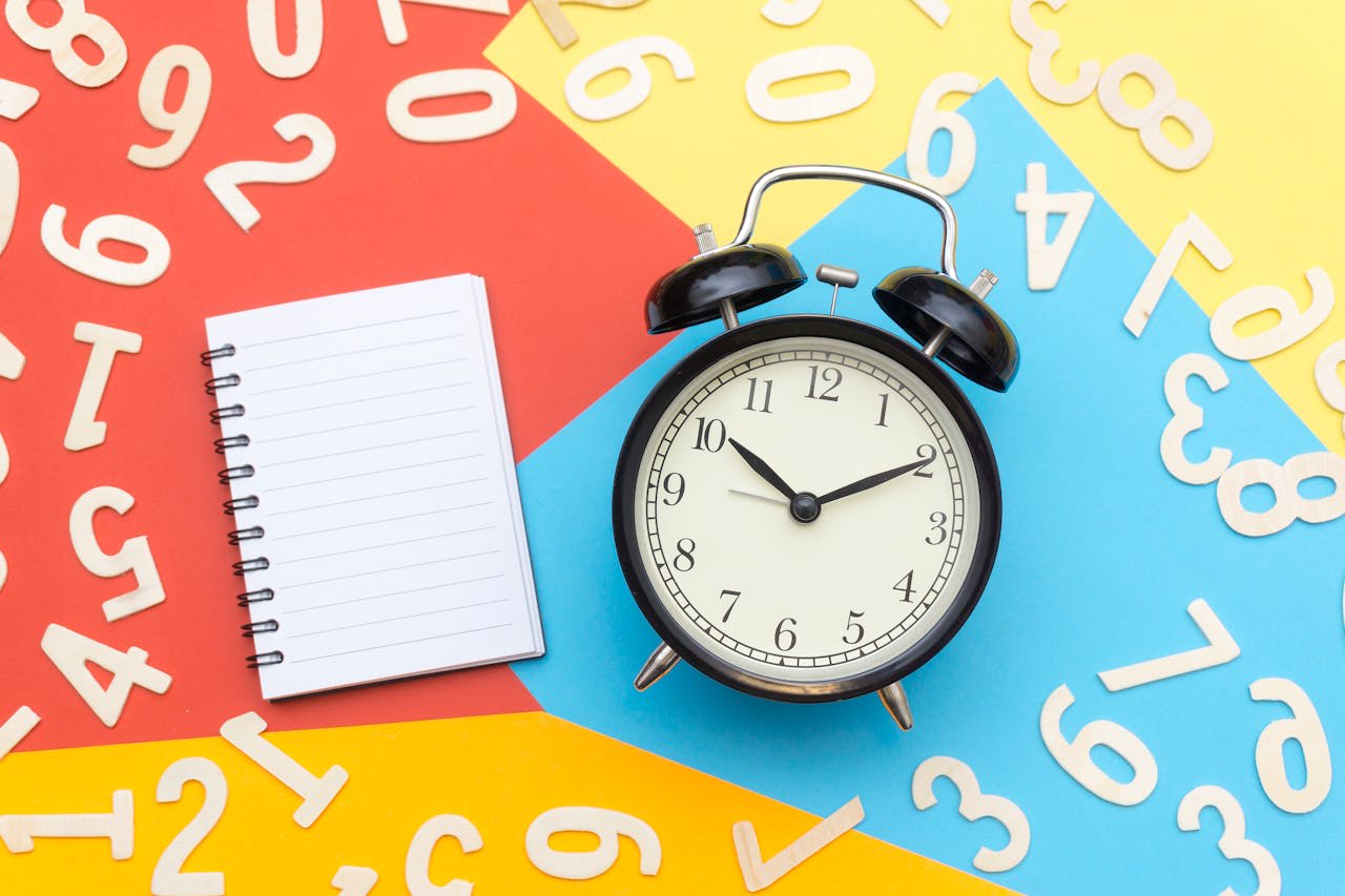 Photo by Black  ice: https://www.pexels.com/photo/alarm-clock-lying-on-multicolored-surface-1314544/ 