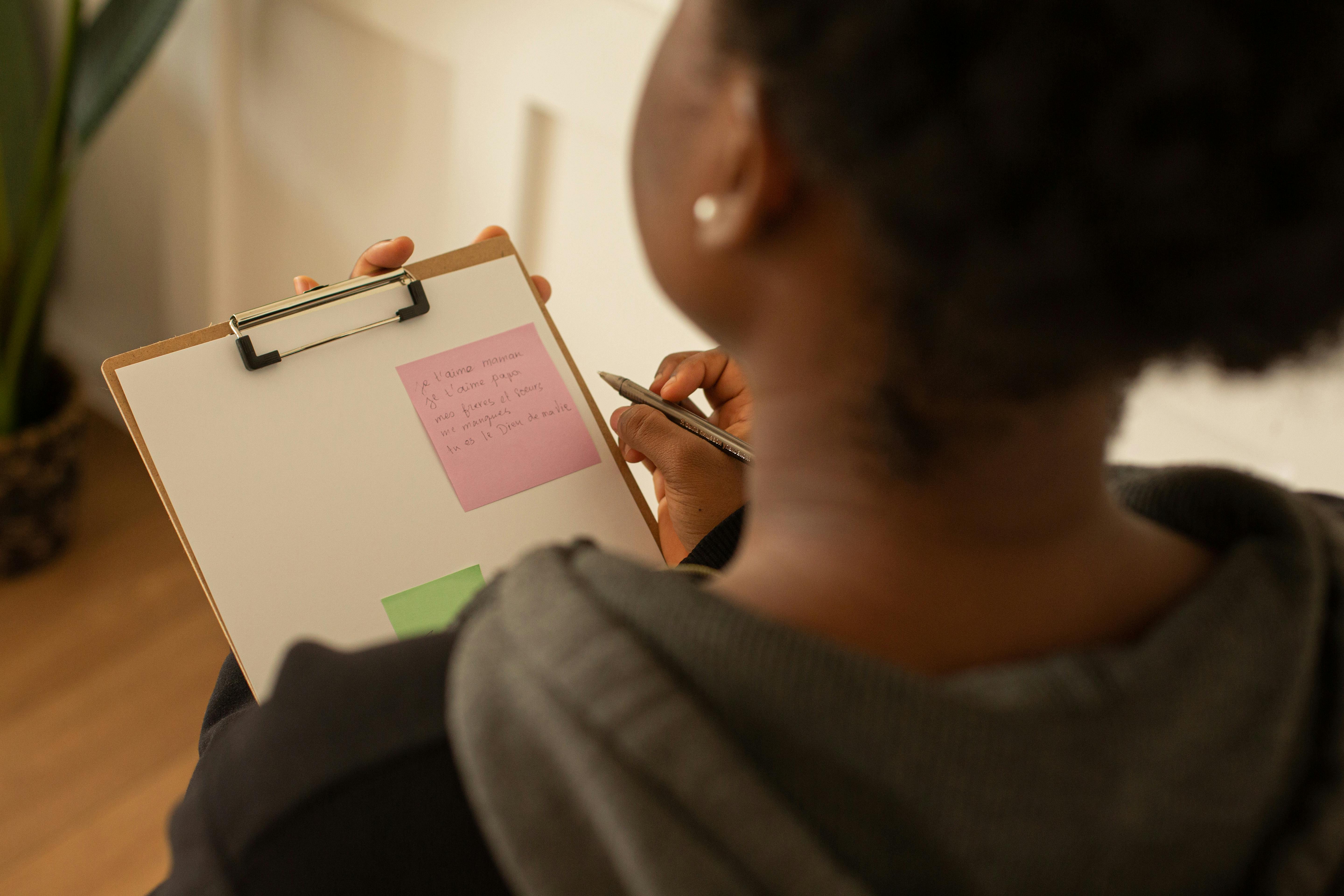 Photo by Monstera Production: https://www.pexels.com/photo/a-woman-holding-a-clipboard-and-a-pen-9433151/