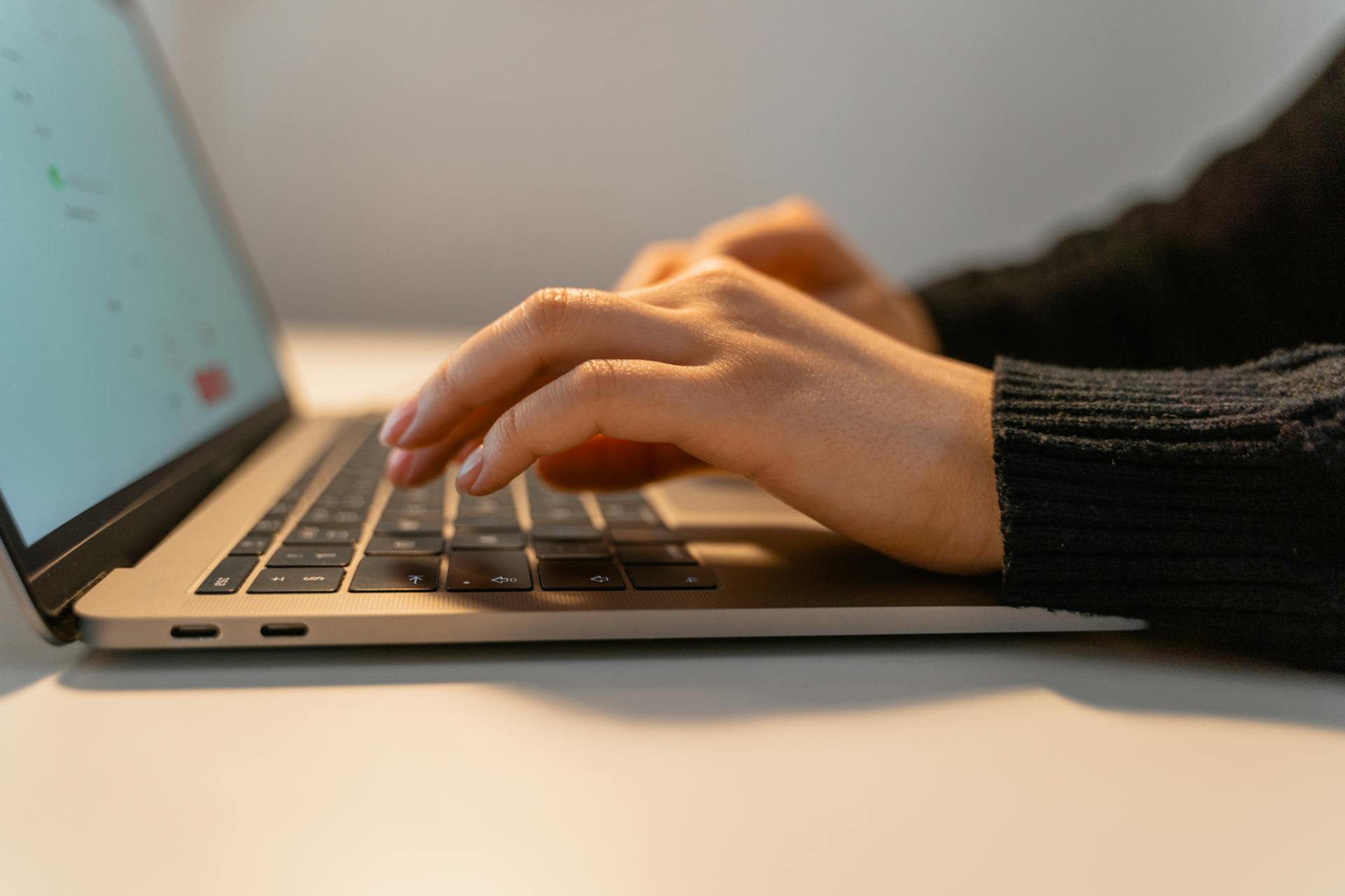 Photo by MART  PRODUCTION: https://www.pexels.com/photo/a-person-typing-on-a-laptop-7709123/