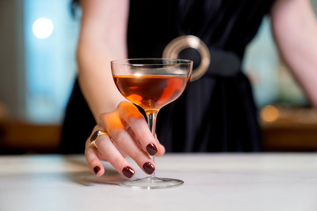 Photo by The OurWhisky Foundation 🥃: https://www.pexels.com/photo/closeup-of-a-woman-holding-a-glass-of-a-liquor-16374105/ 