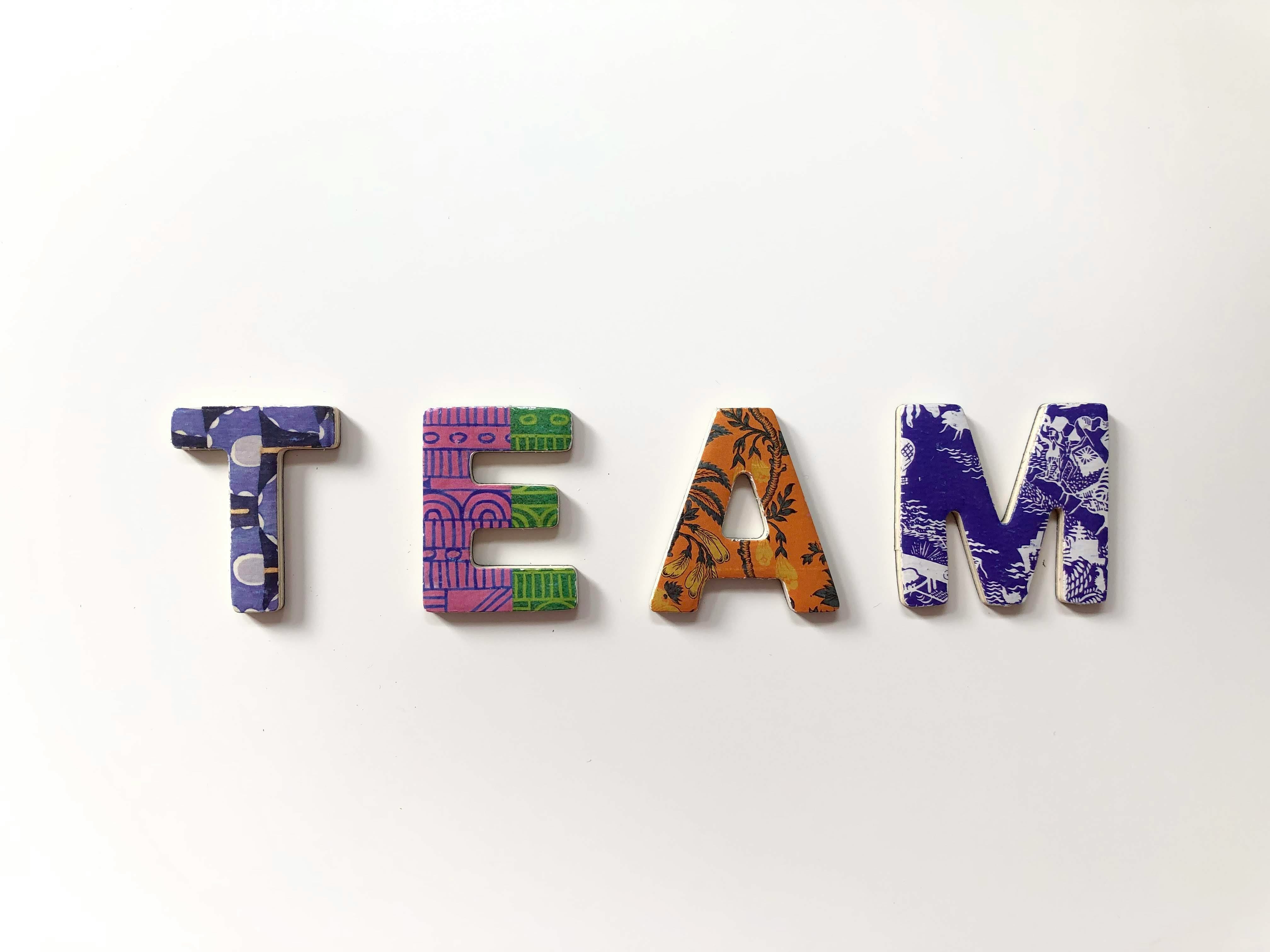 https://unsplash.com/photos/team-freestanding-letters-RxOrX1iW15A ALT Text: Image of the word Team in block letters. 