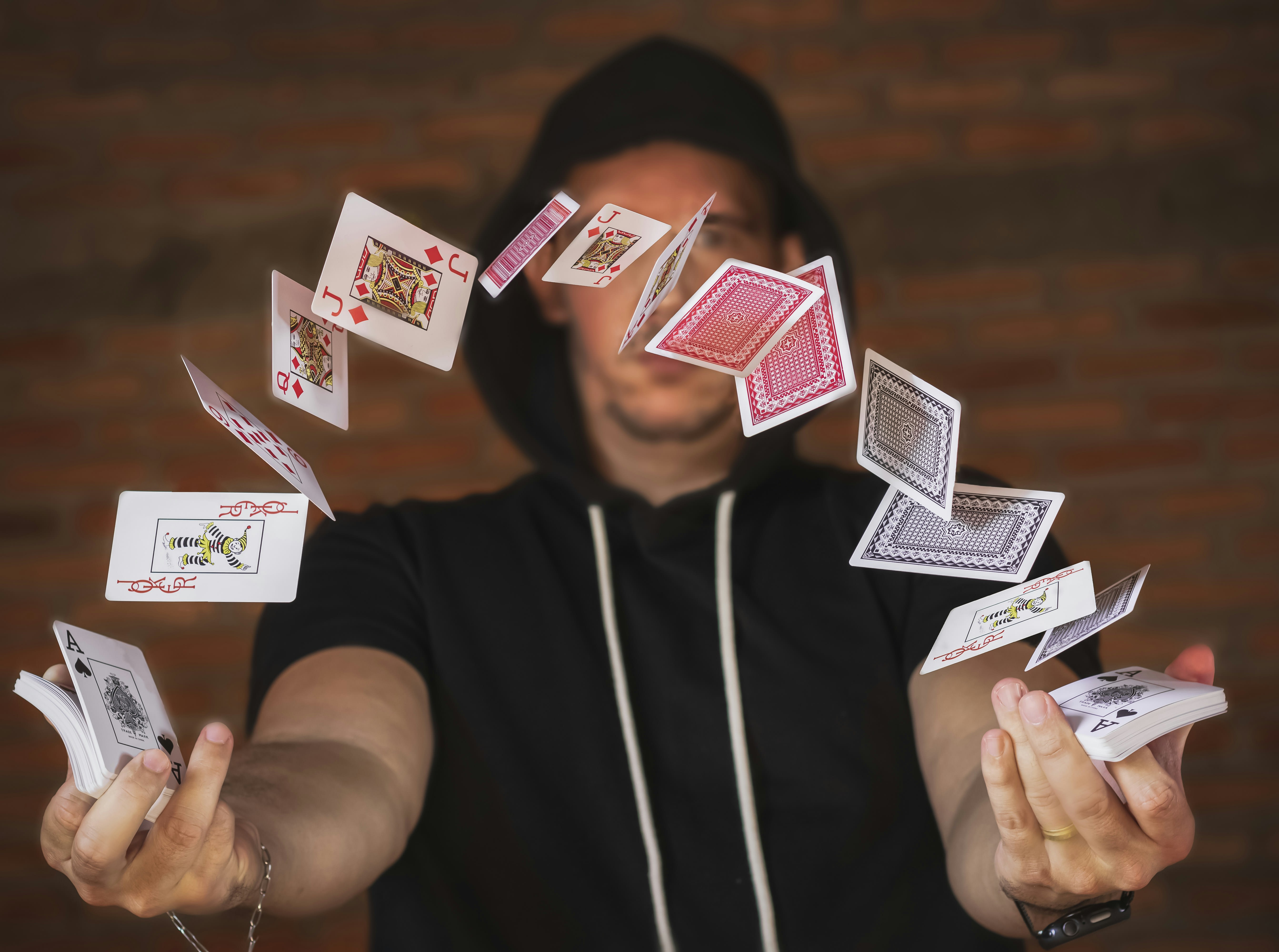 https://unsplash.com/photos/woman-in-black-and-white-crew-neck-t-shirt-holding-playing-cards-YlgnX_ISPLo