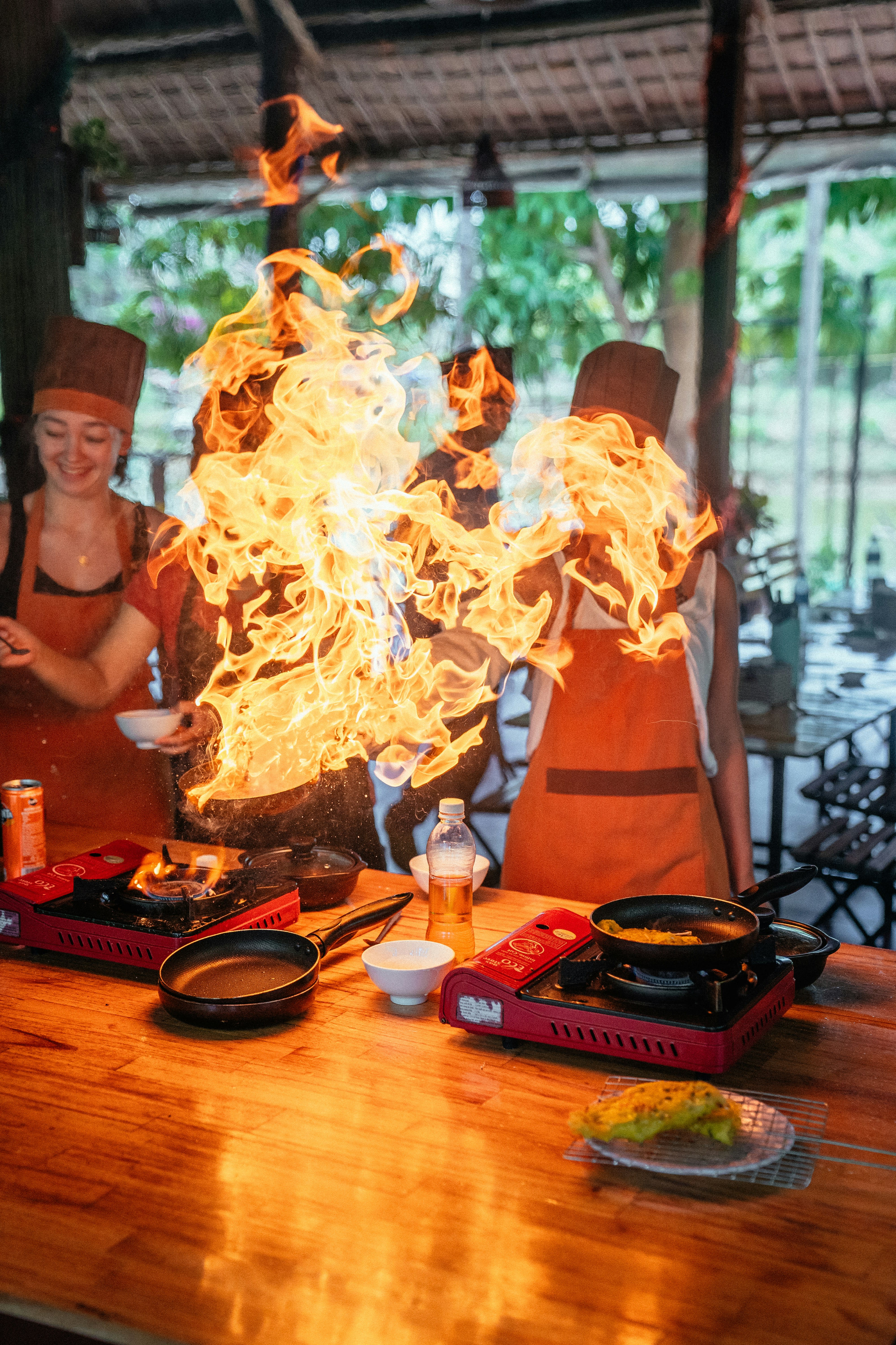 https://unsplash.com/photos/a-group-of-people-standing-around-a-table-covered-in-fire-C6zHyDCWhwA