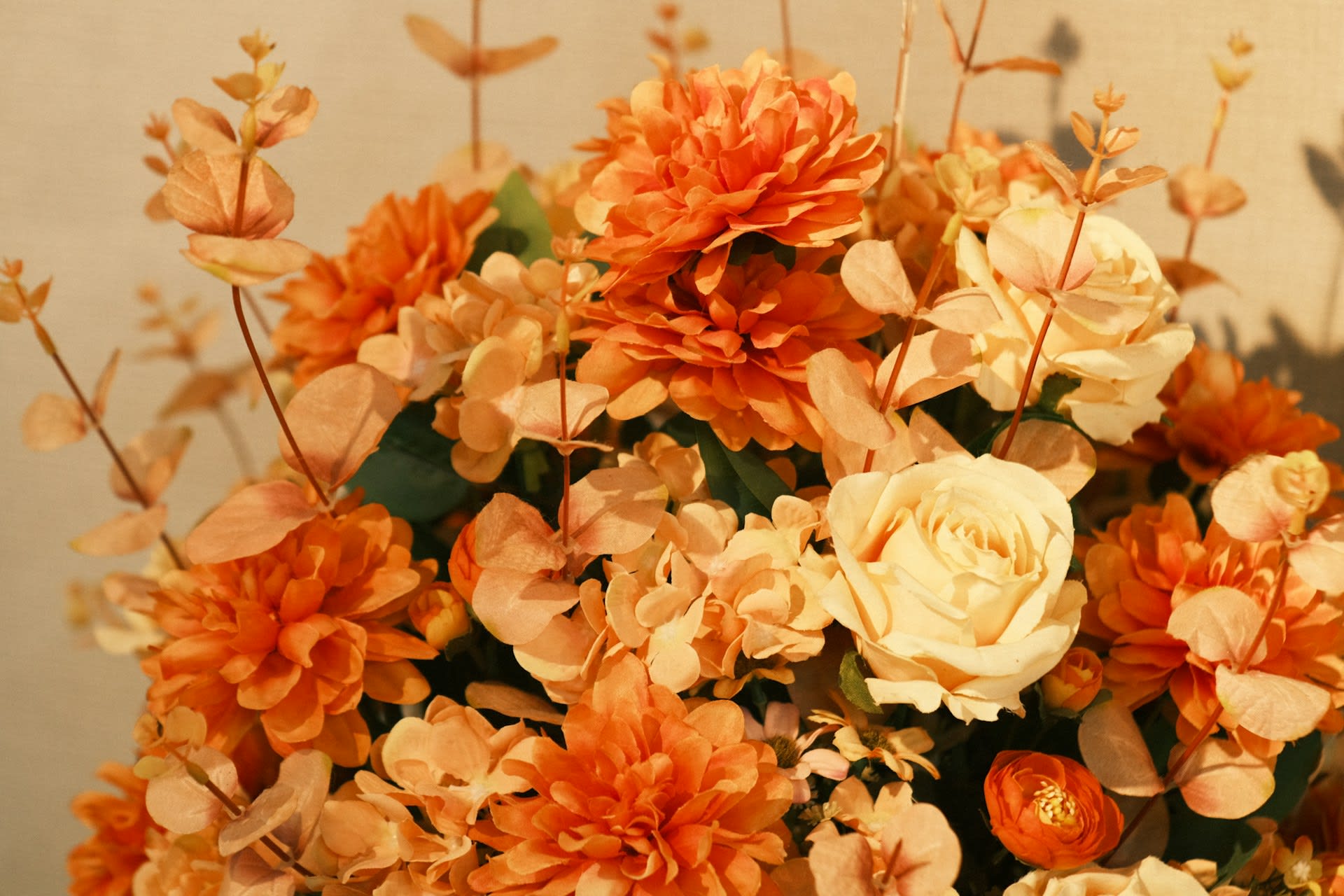 https://unsplash.com/photos/a-vase-filled-with-lots-of-orange-and-white-flowers-RE5mLz9jc7I
