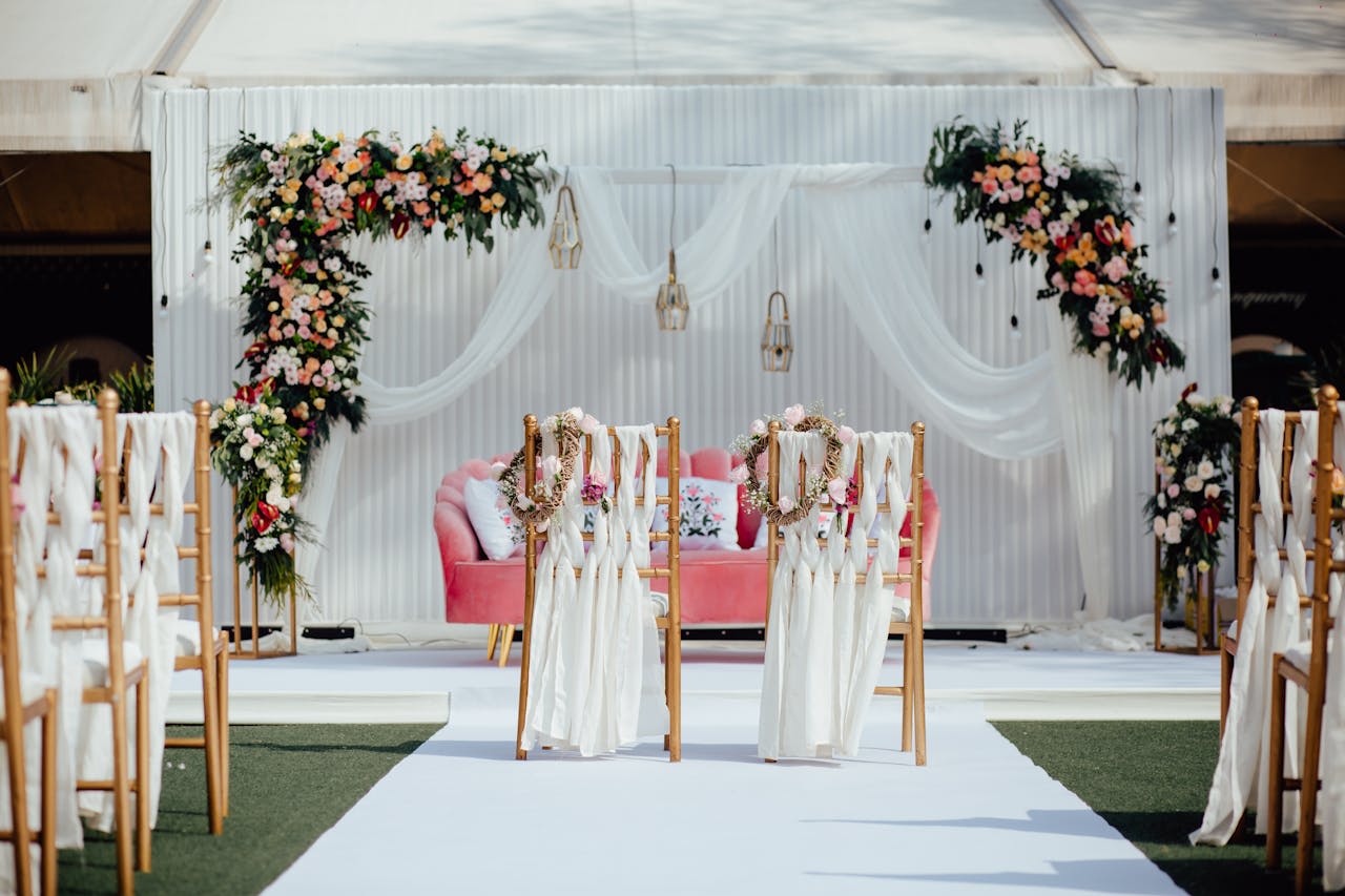Photo by The Visionary Vows: https://www.pexels.com/photo/elegant-outdoor-wedding-ceremony-setup-with-floral-decorations-32854438/