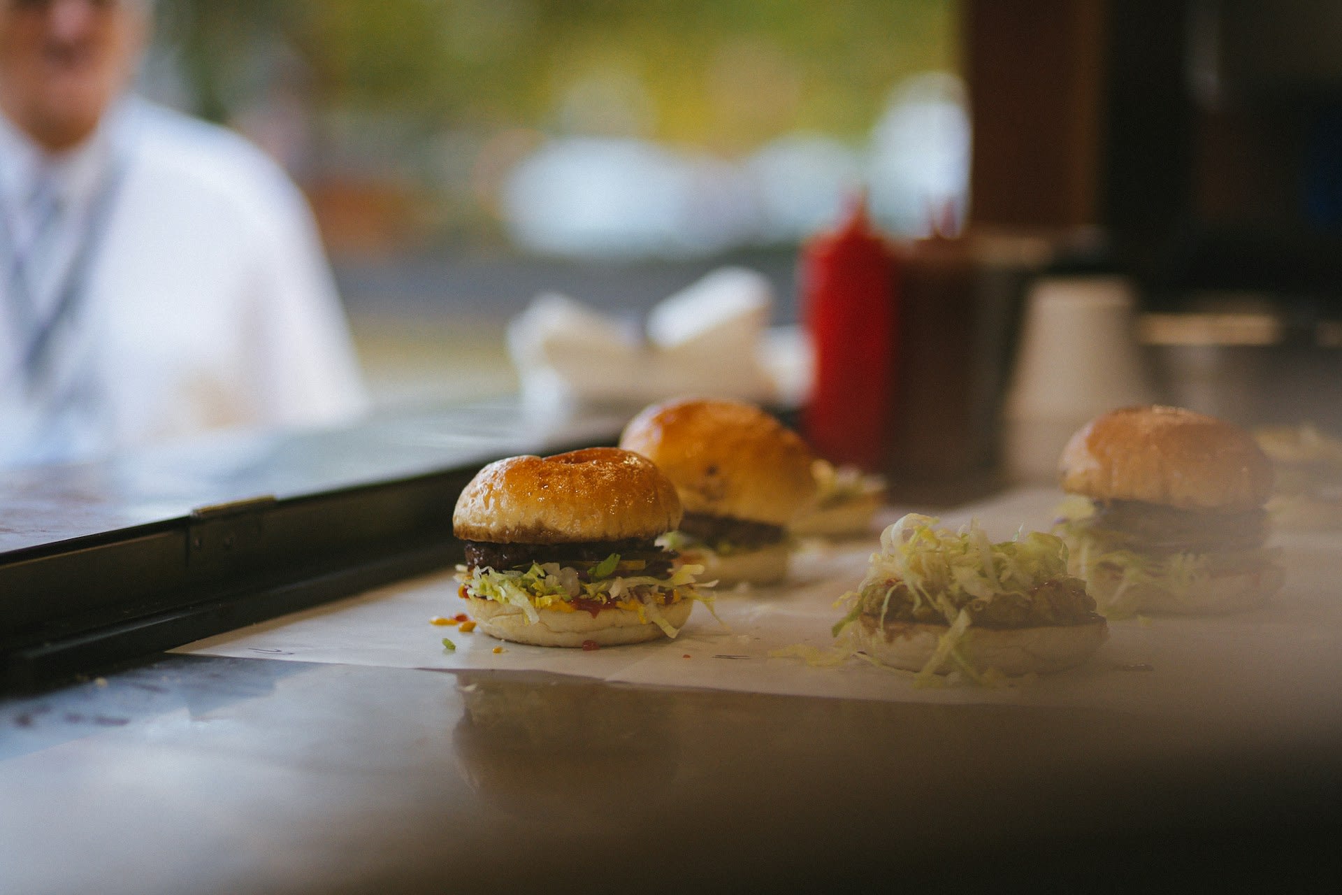 https://unsplash.com/photos/burger-buns-on-table-VHYAxy2UgQ8