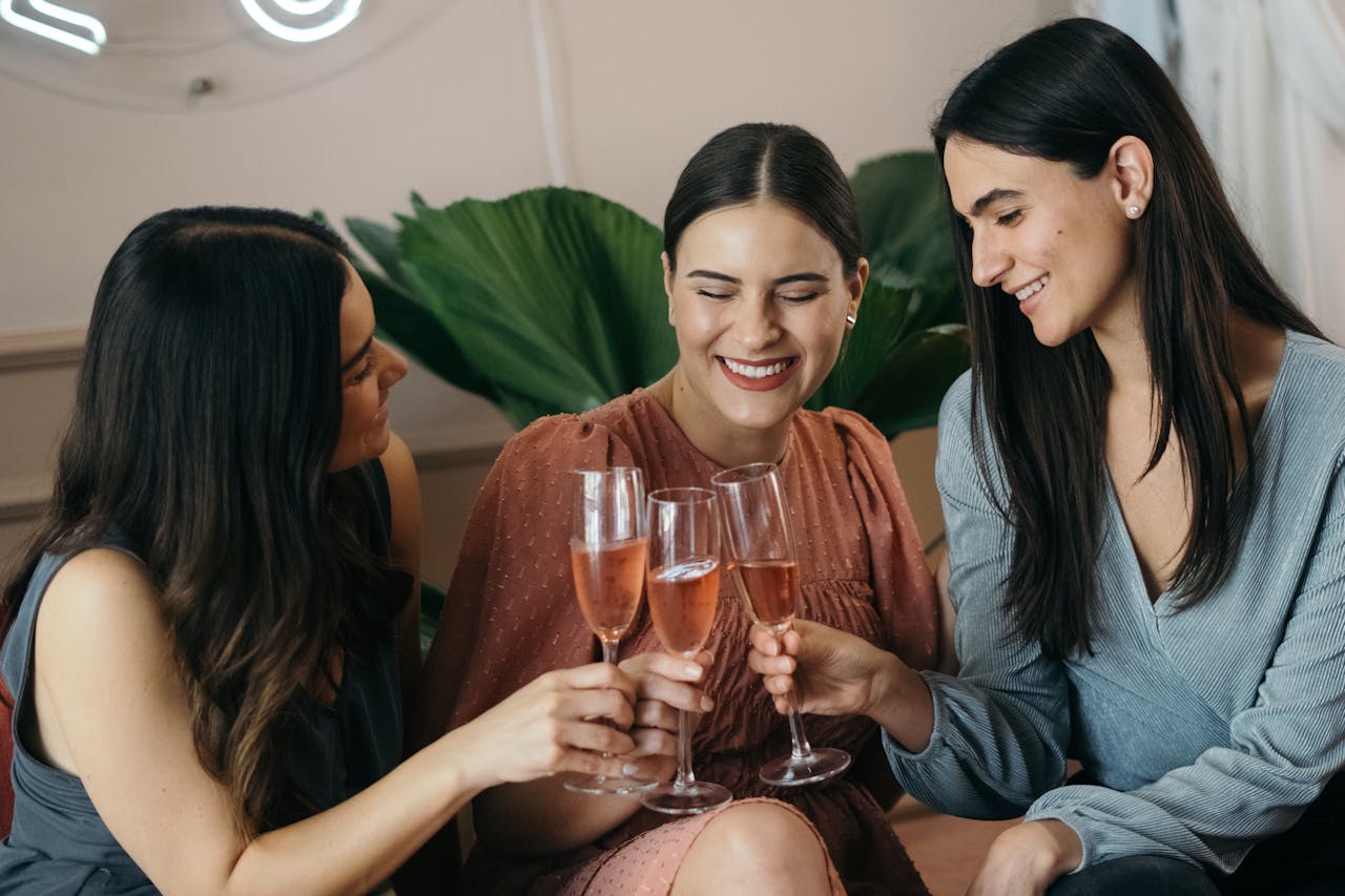 Photo by Los Muertos Crew: https://www.pexels.com/photo/women-sitting-and-clinking-glasses-with-champagne-8459397/