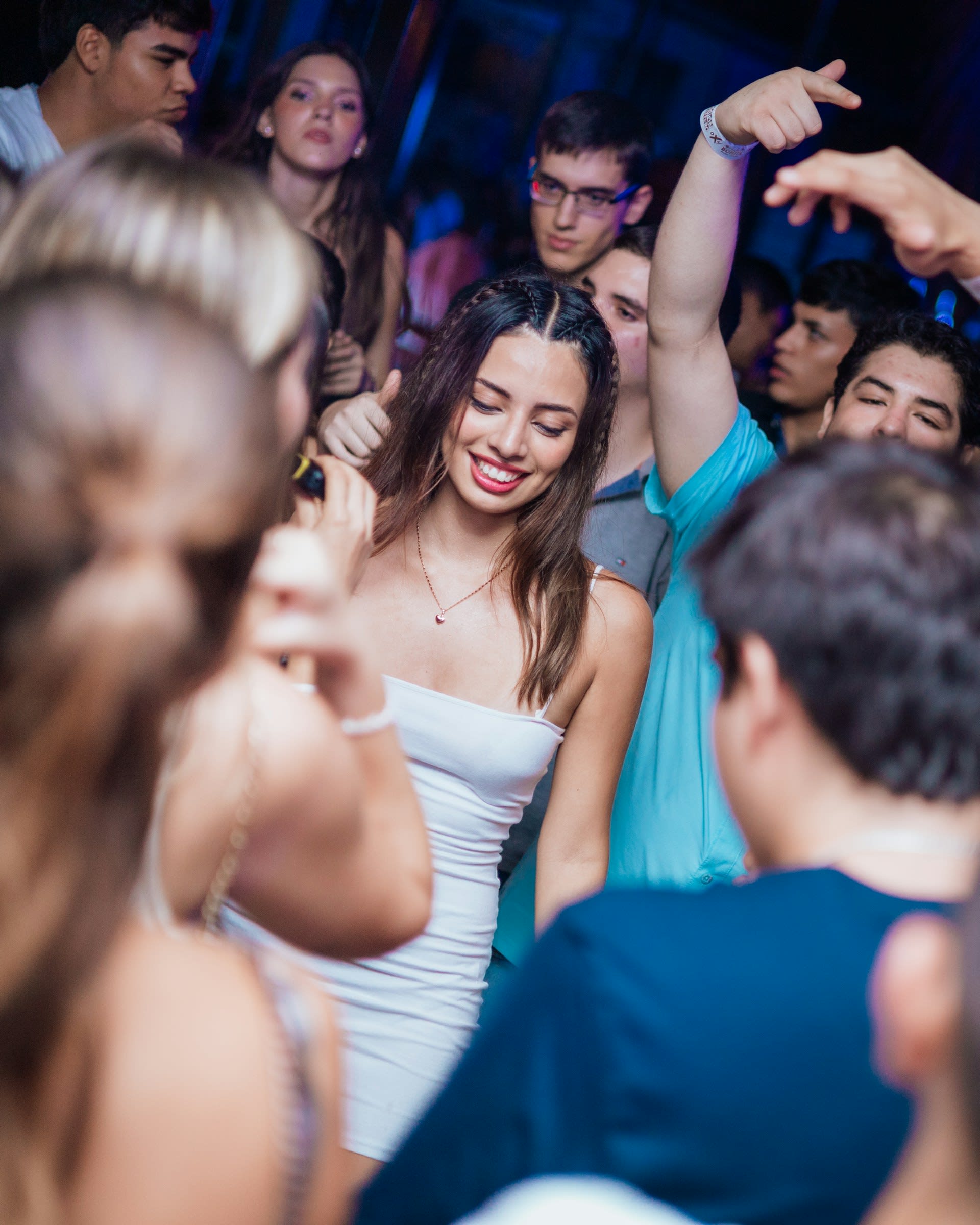 https://unsplash.com/photos/a-group-of-people-dancing-at-a-party-7MiNPsl7Oto