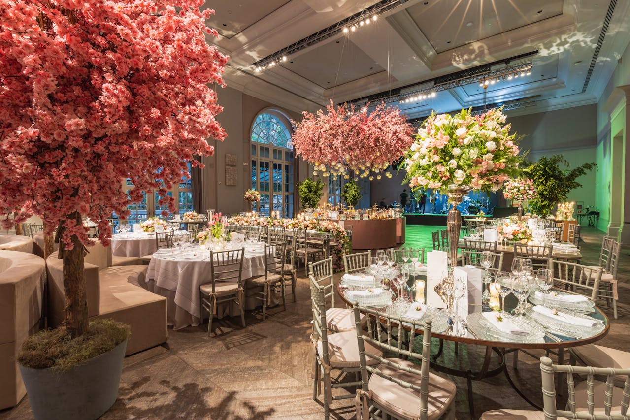 https://www.pexels.com/photo/artificial-cherry-trees-decorating-a-luxury-hall-for-a-wedding-reception-17023010/