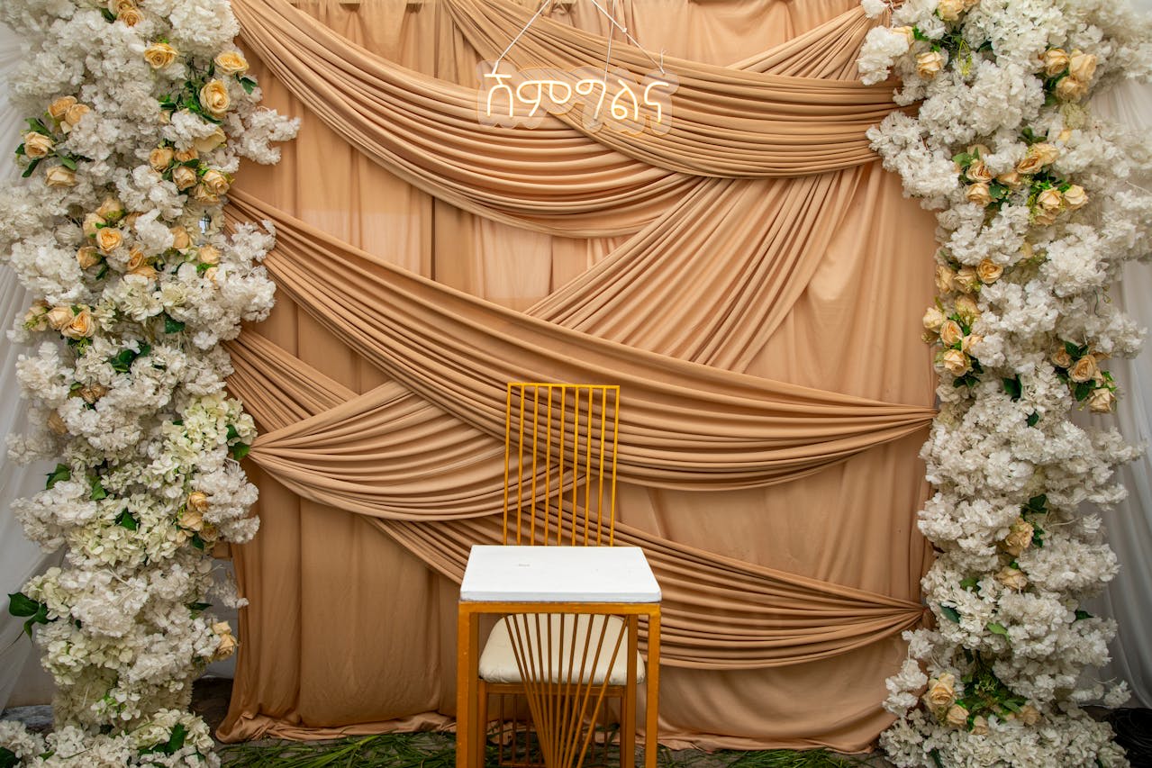 https://www.pexels.com/photo/elegant-wedding-backdrop-with-floral-arrangements-36178502/