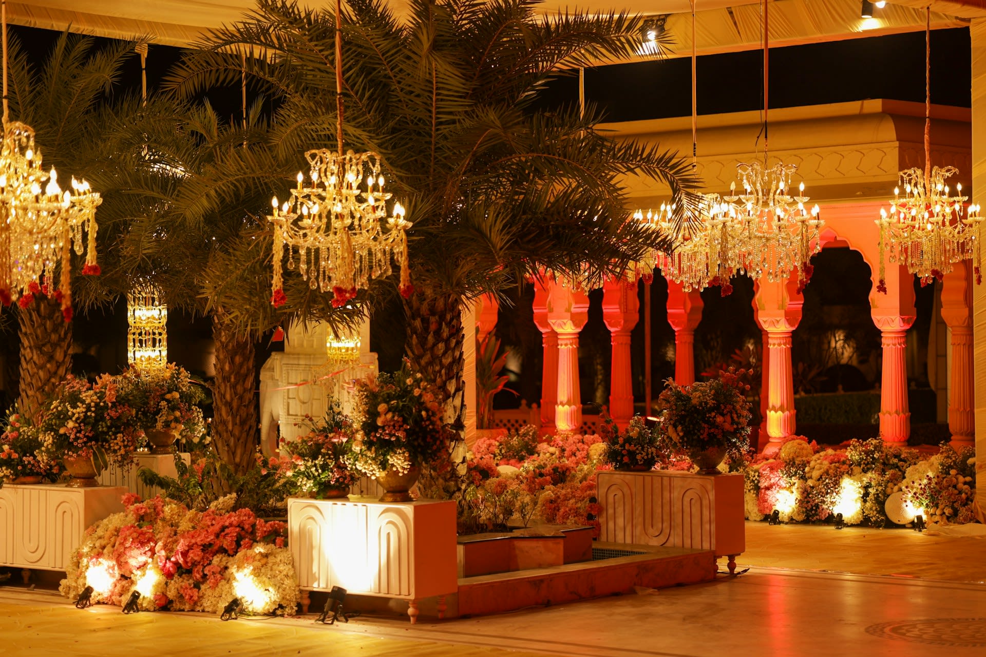 https://unsplash.com/photos/elegant-wedding-venue-with-chandeliers-and-floral-arrangements-AzvGCVHGPCE