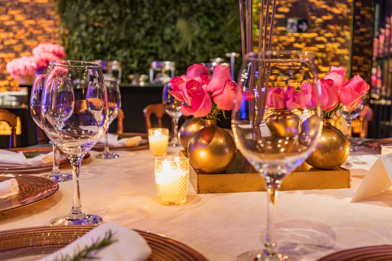 https://www.pexels.com/photo/wax-candles-glasses-and-flowers-on-table-16935903/