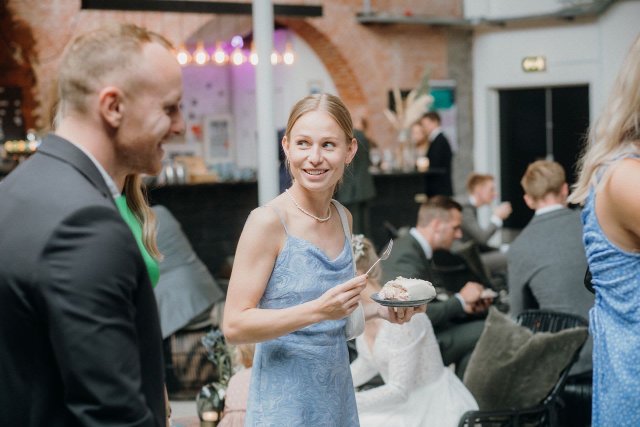 Photo by Rene Terp: https://www.pexels.com/photo/smiling-woman-and-man-on-ceremony-among-people-14203534/
