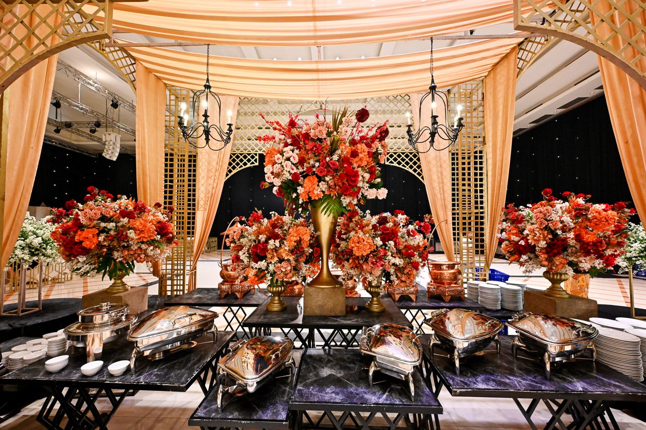 https://www.pexels.com/photo/luxurious-wedding-banquet-setup-with-floral-arrangements-36766850/
