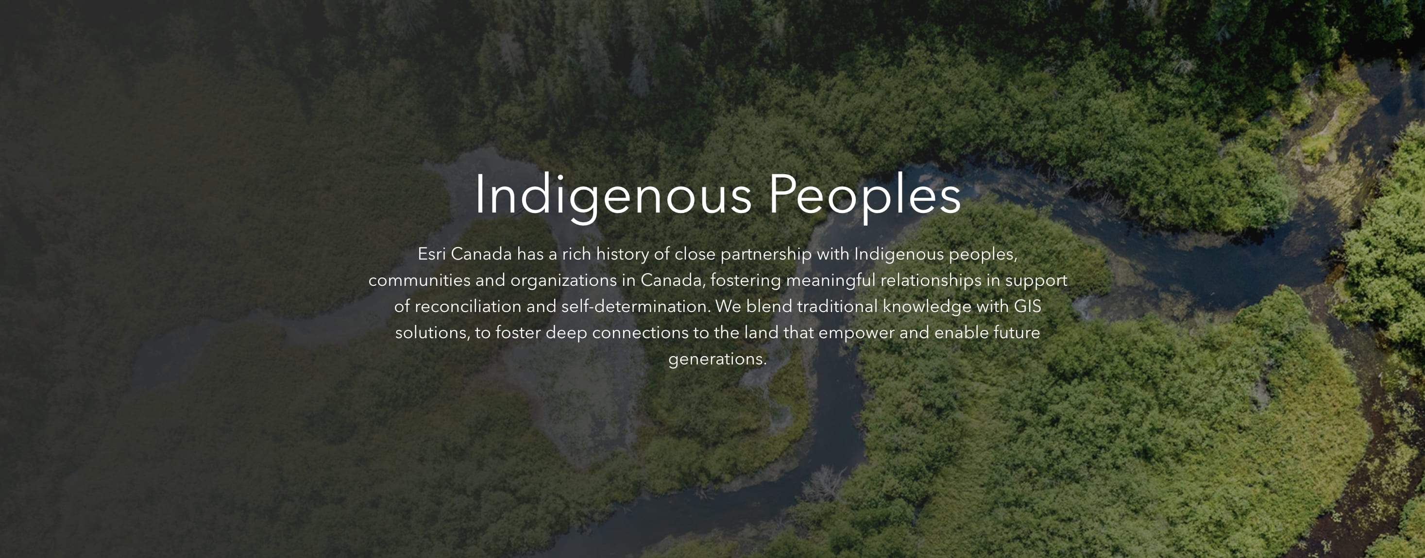 Aerial view of forests and rivers, highlighting Esri Canada's support for Indigenous peoples, communities and organizations in their pursuit of reconciliation and self-determination.