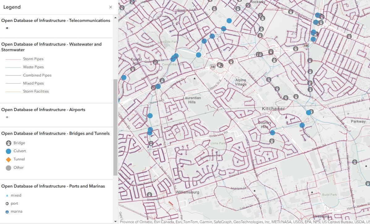 Une carte montrant les types d’infrastructures à Kitchener, en Ontario, à partir de la base de données ouverte des infrastructures. Une légende sur la gauche énumère les types d’infrastructures et leur symbologie associée, y compris des lignes de différentes couleurs pour les eaux usées et les eaux pluviales, ainsi que des icônes spécialisées pour les télécommunications, les aéroports, les ponts et tunnels et les ports et marinas.