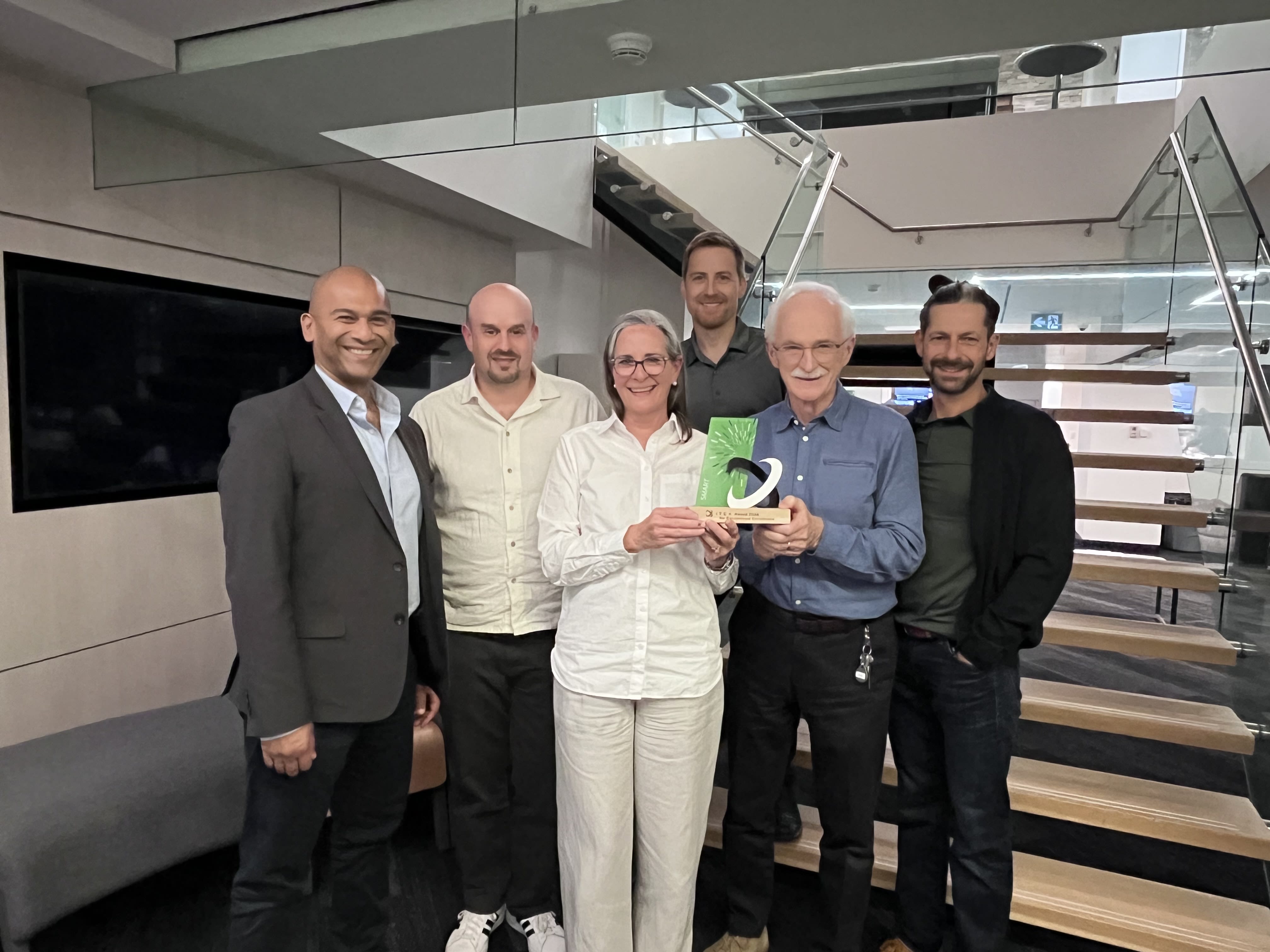 The SMART mobility project team at Esri Canada proudly holding the ITEA Award of Excellence for Innovation, Business Impact, and Standardization. First row from left: Arif K. Rafiq, Industry Manager, Transportation; David Stajan, Senior Technical Lead, Solutions Design; Jennifer Overbury, Program Director, Emerging Technologies; Alex Miller, President; Darrin Williams, Executive Director, Connected Communities & Emerging Technologies. Second row: Jeff Kirchner, Senior Business Analyst.