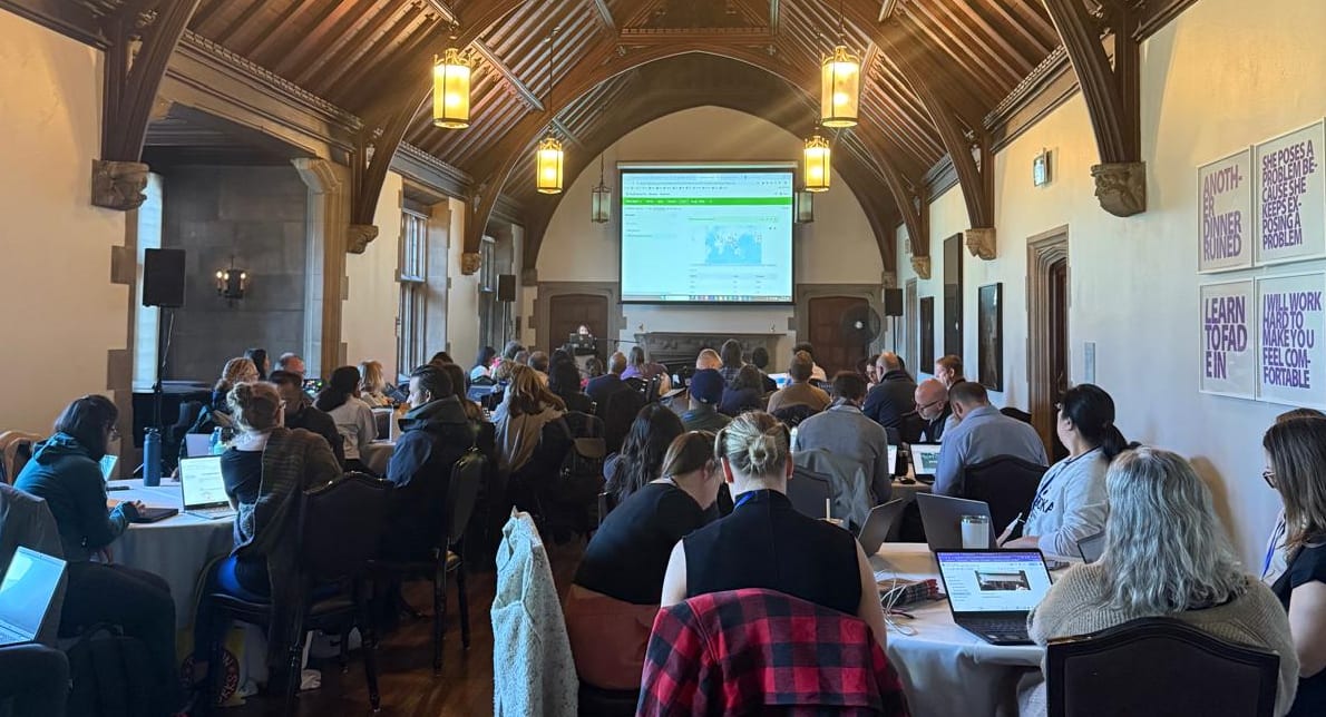 A room full of educators during a conference session.