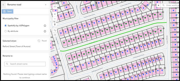 Map interface showing a residential area with multiple property parcels outlined in black and shaded pink, each labelled with numbers. Blue dots and green circles appear within parcels and a green-highlighted road runs horizontally through the center, labelled ‘Raiford Street (Town of Aurora).’ On the left panel, options for renaming the road are displayed, including a ‘Save’ button, municipality filter choices (‘Spatially by: A3Polygon’ and ‘By attribute’) and a text box to enter a new street name. We recommend setting the Municipality filter to Spatially by: A3Polygon.
