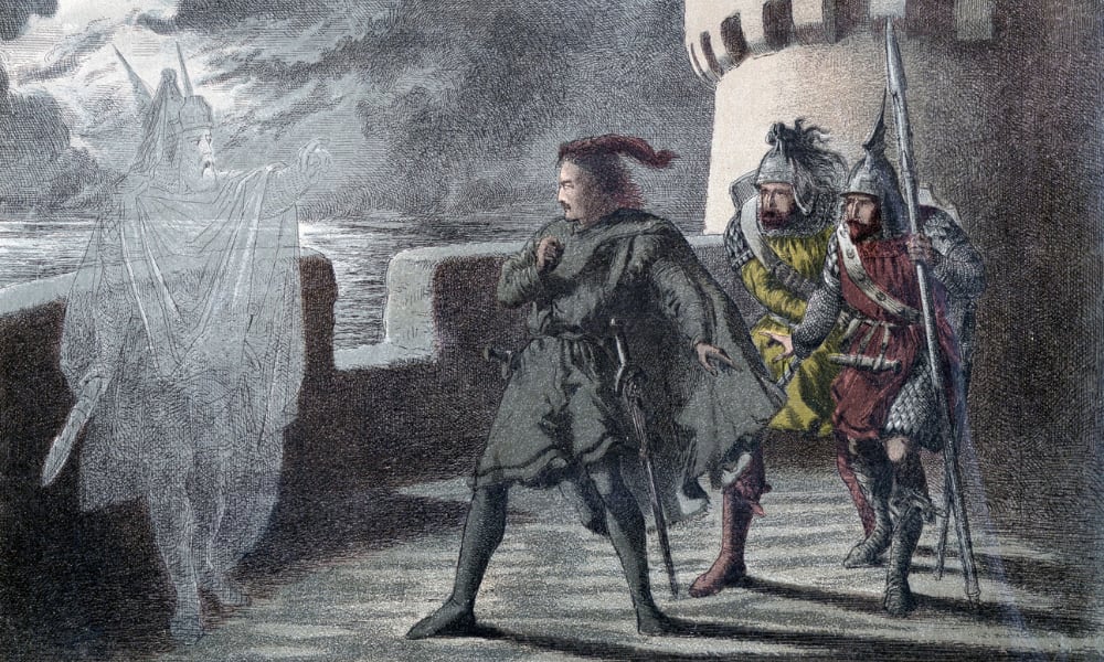 On the battlement of a Medieval castle, a man in dark Renaissance clothing is confronted by a silver ghost wearing robes and a winged helmet. Behind the man in black are two guards, one wearing yellow and one in red.