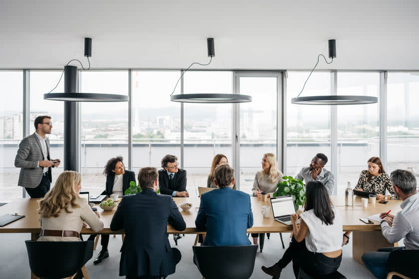 A board education seminar taking place at a long office table