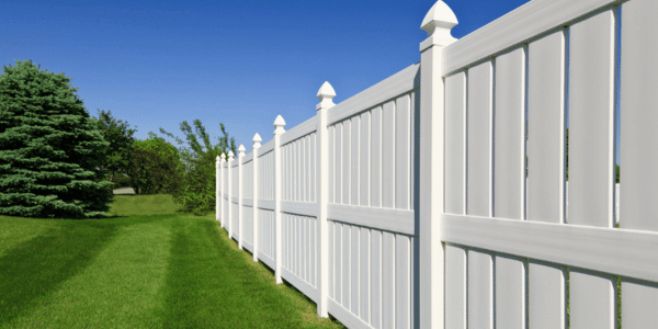 home with new white vinyl fence