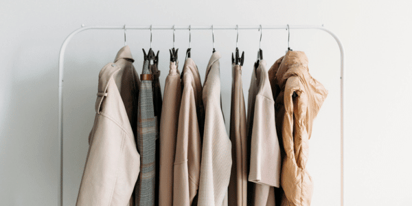 womens capsule wardrobe clothes hanging from rack