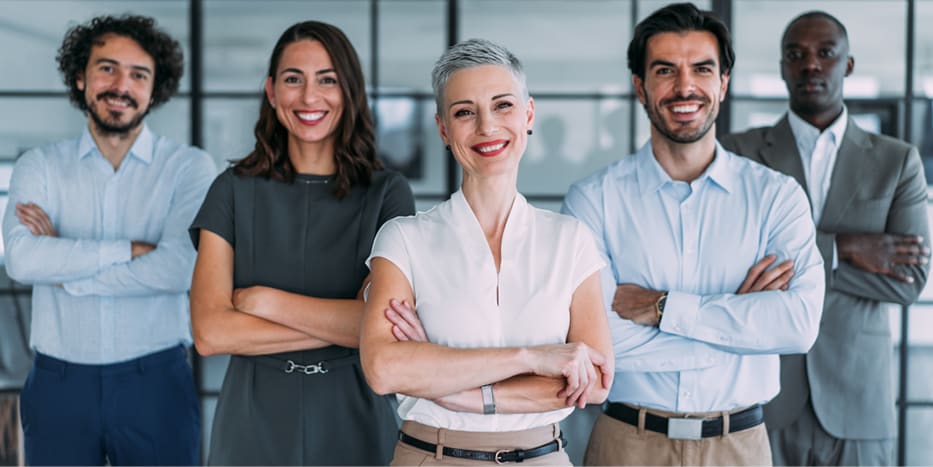 group of professionals standing with arms crossed