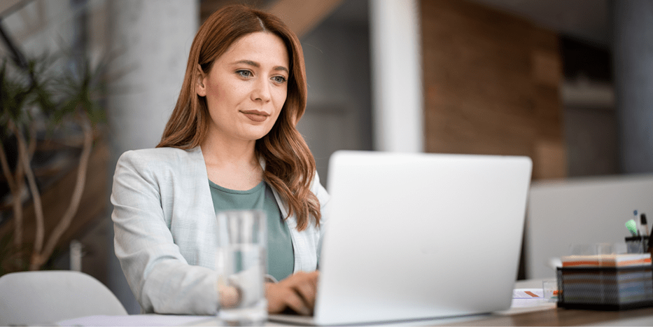 woman typing on a laptop