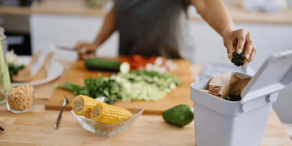 woman composting at home