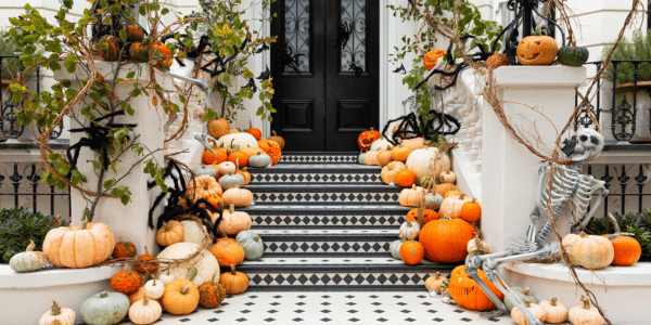 pumpkins decorated on the front porch for fall