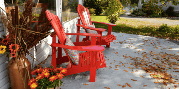 red chairs decorated for fall on patio