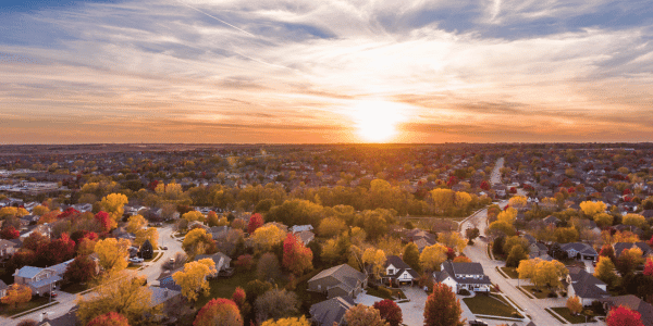 fall sunset during daylight savings time in suburban neighborhood