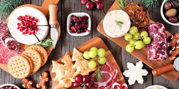 Christmas theme charcuterie top view table scene against dark wood stock photo